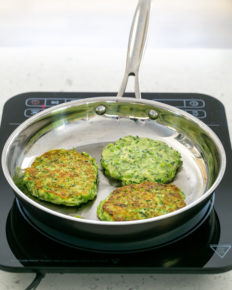 zucchini Fritters in the pan cooking