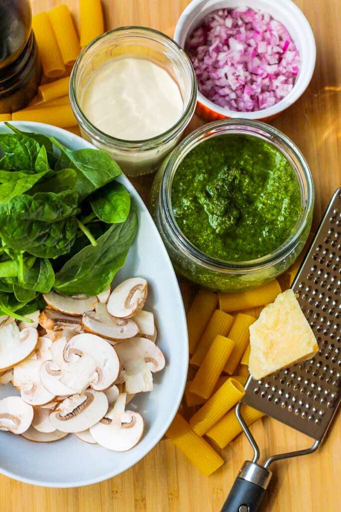 ingredients for rigatoni with brown mushrooms and pesto sauce