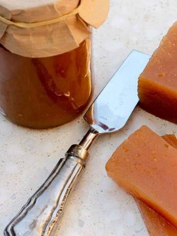 Quince paste in a jar and some sliced