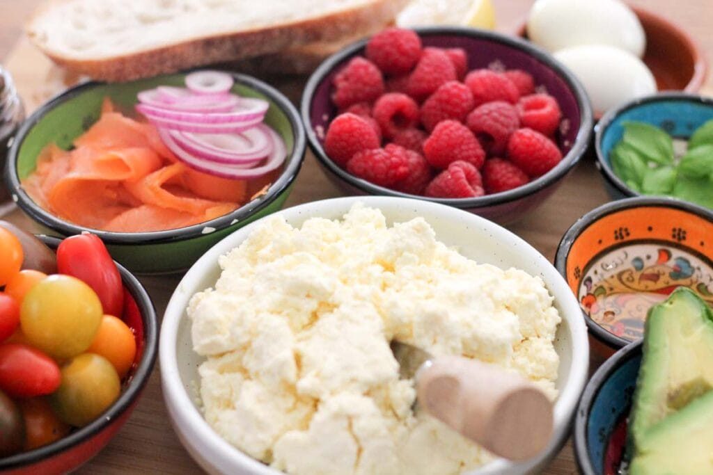 homemade ricotta served with smoked salmon, raspberries, tomatoes and avocado