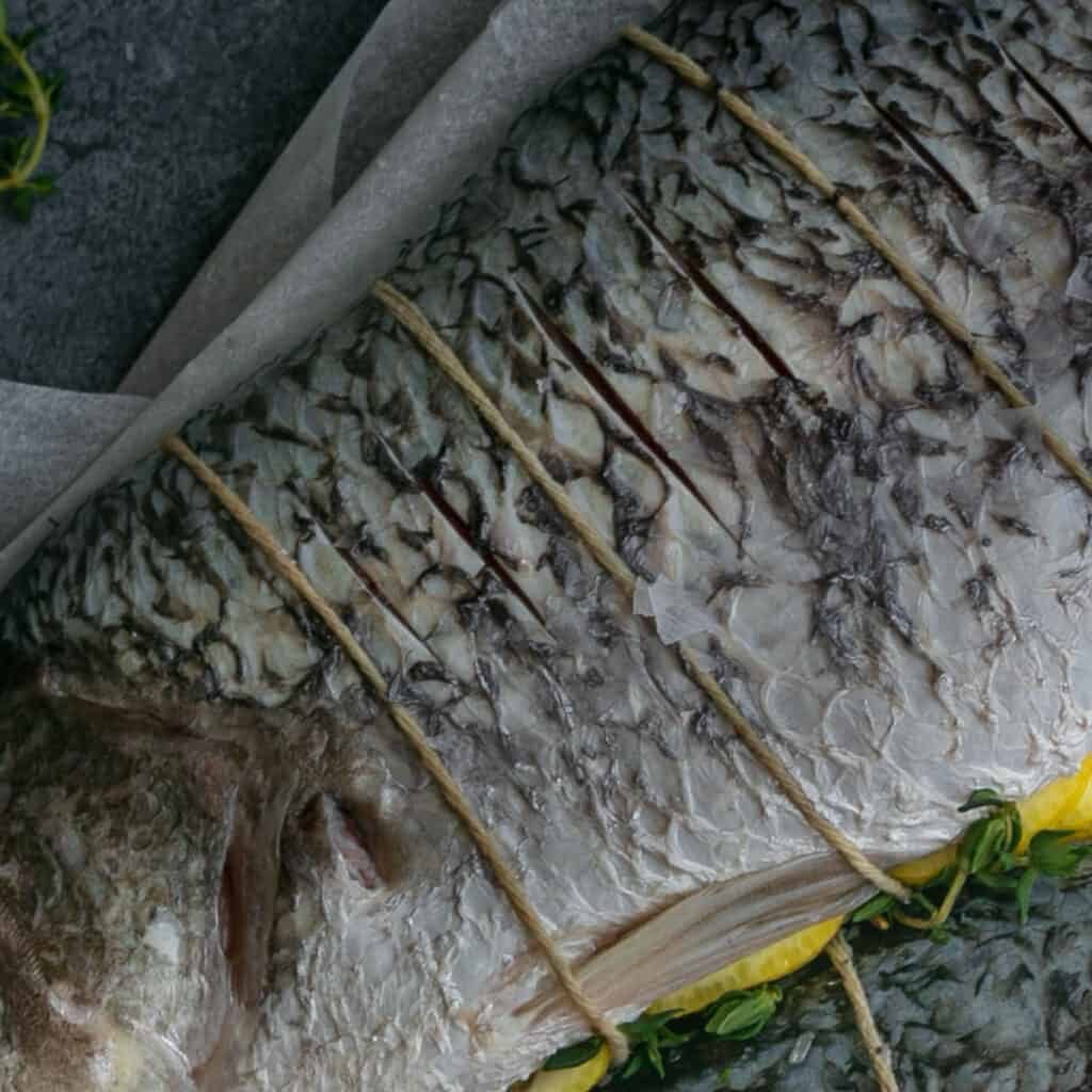 Whole fish stuffed with lemon, garlic and herbs