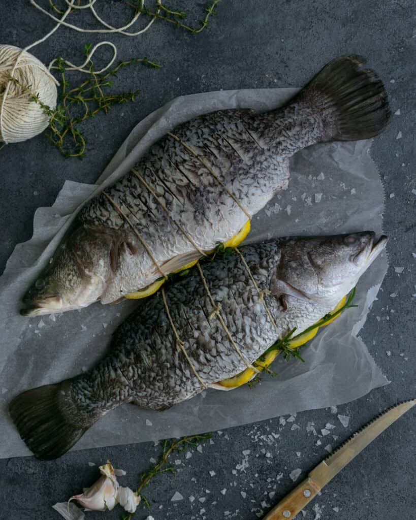 Whole barramundi fish ready to be baked