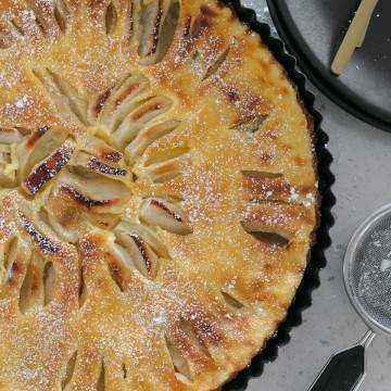 French Apple Tart dusted with icing sugar