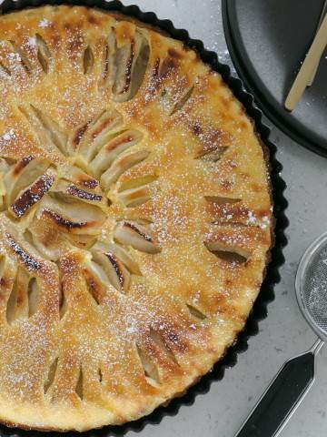 French Apple Tart dusted with icing sugar