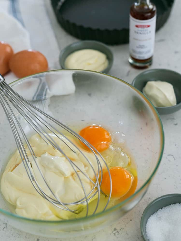 ingredients in a bowl for the filling for apple tart