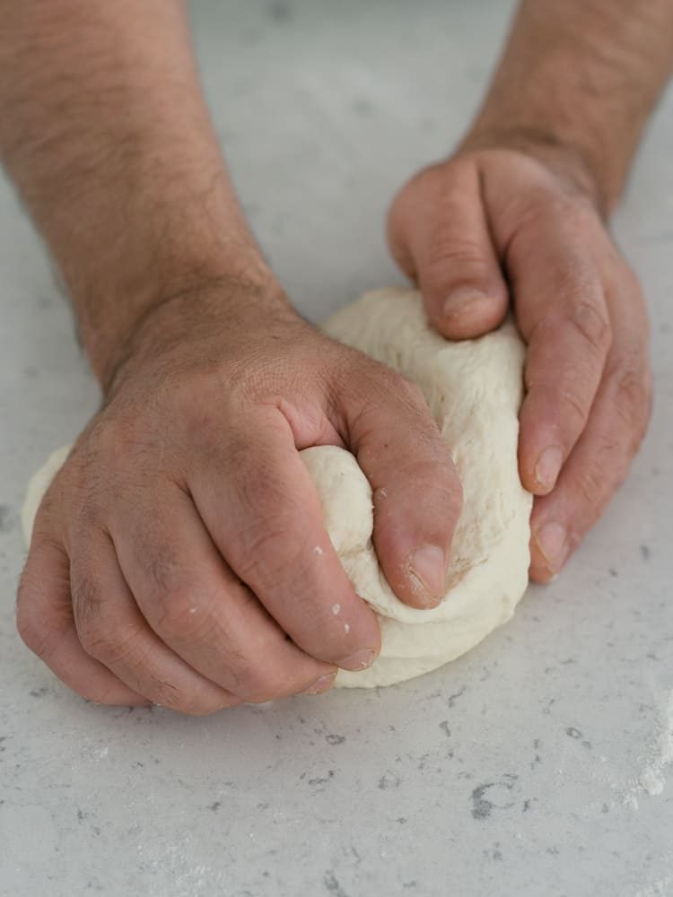 kneading the dough for naan bread