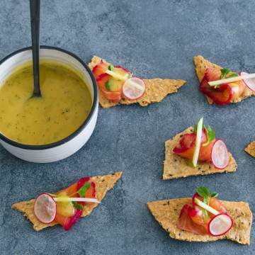 Bowl of Mustard and Dill Sauce with cured salmon canapes