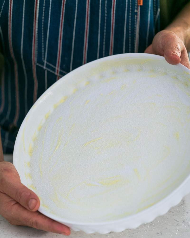 Sugar sprinkled on greased baking dish