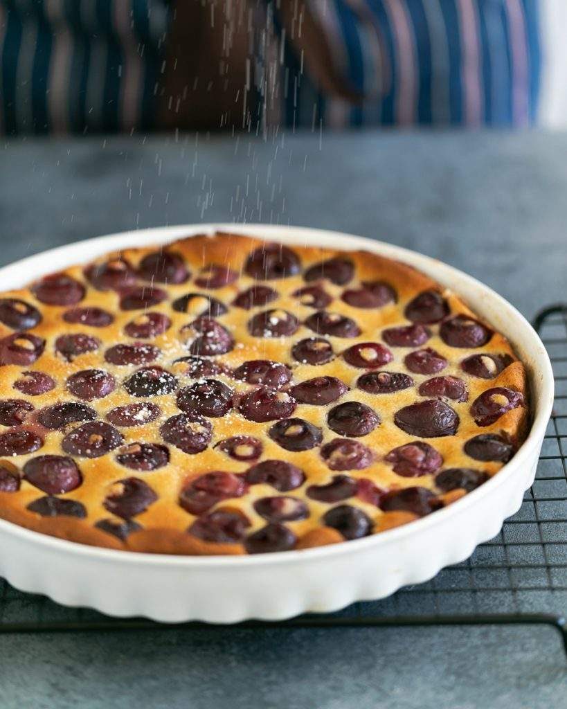 Icng sugar dusted over clafoutis