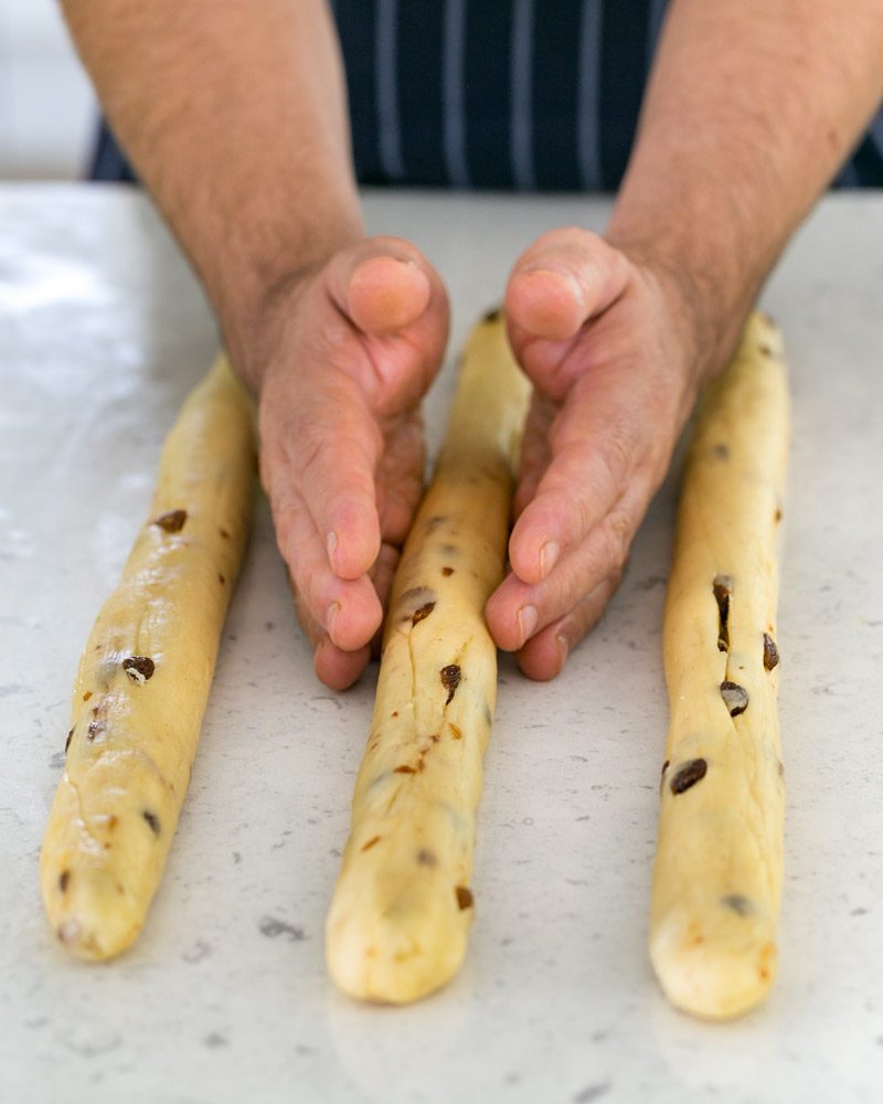 Rolled out dough balls into three braids