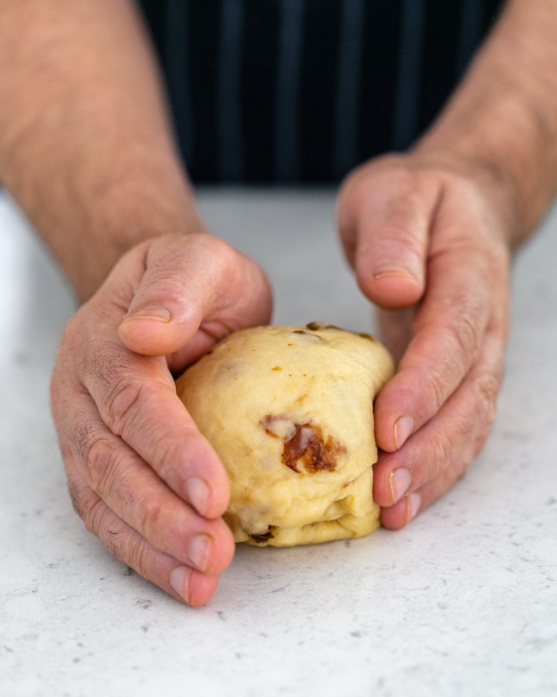 Kneading zopf dough after proofing