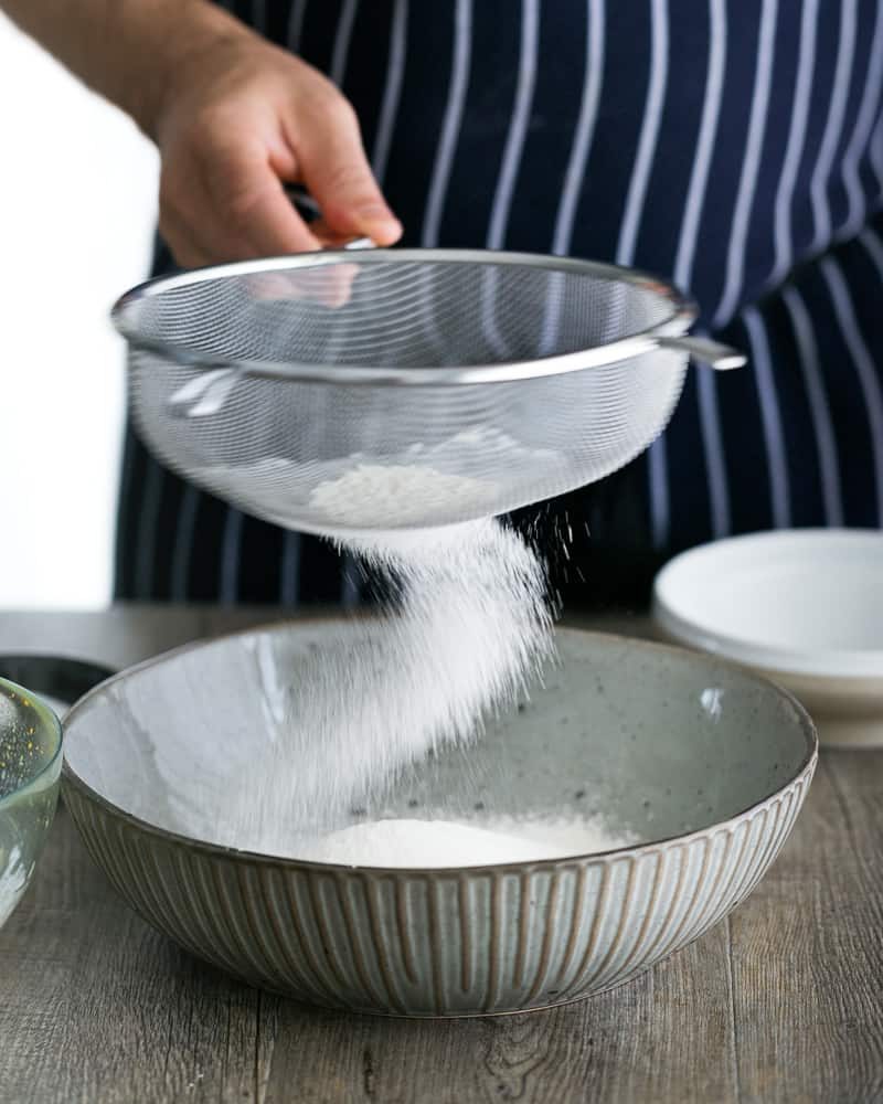 Sifting Flour in a sieve 