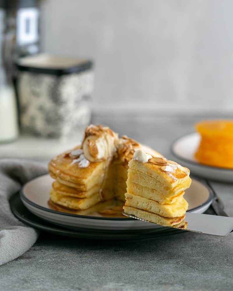 Souffle-Styled Pancake stack Sliced and served with fresh ricotta and almonds