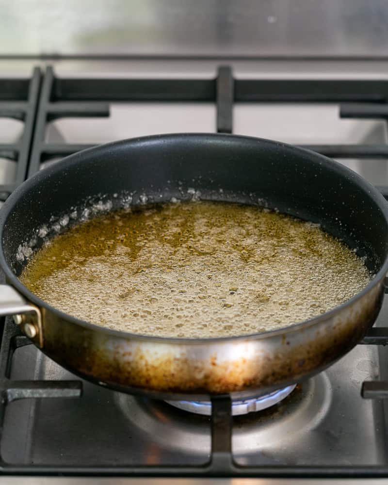 Sugar and water turning into caramel in the pan