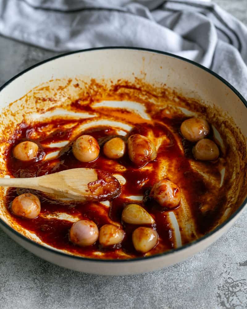 shows a saucy texture after deglazing pan with tomato paste and shallots