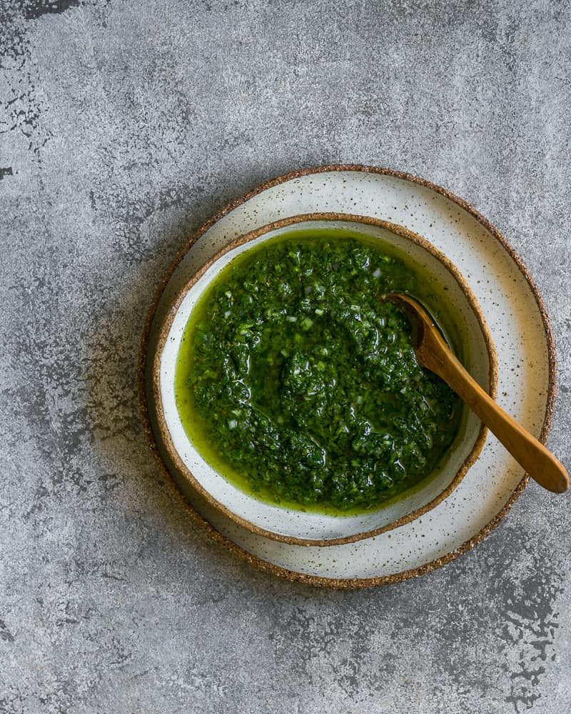 Freshly prepared chimichurri served beautifully in a ceramic bowl