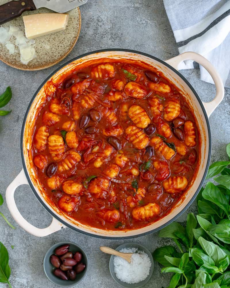 Easy Ricotta Gnocchi's with tomatoes and olives in a pan