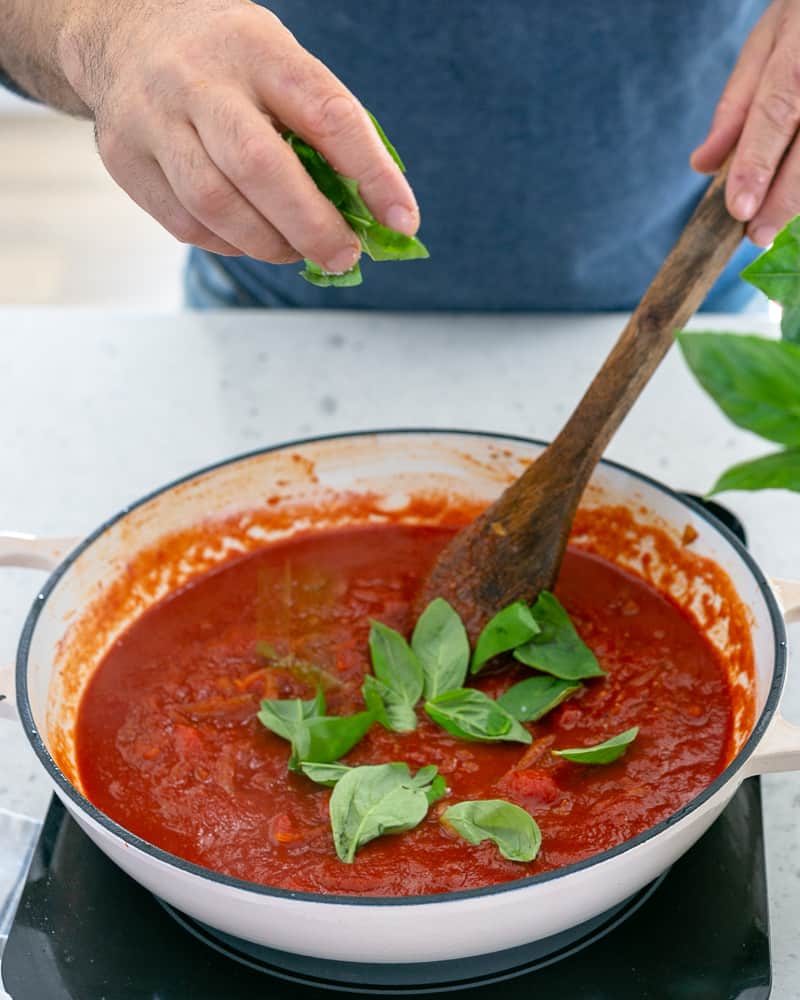 Steps involved in making the sauce for Ricotta Gnocchi's with tomatoes and olives