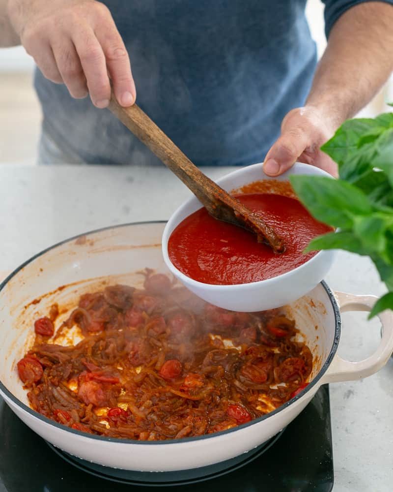 Steps involved in making the sauce for Ricotta Gnocchi's with tomatoes and olives