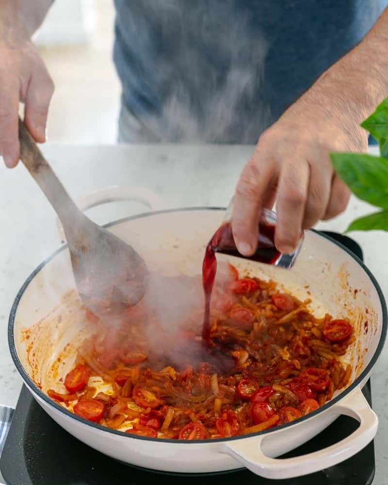 Steps involved in making the sauce for Ricotta Gnocchi's with tomatoes and olives