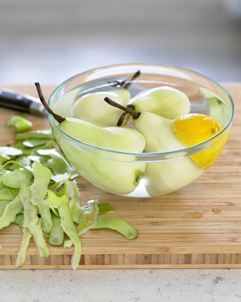 Peeled pears in lemon water to avoid browning
