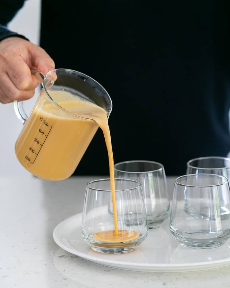 Creme caramel poured into dessert glass to set