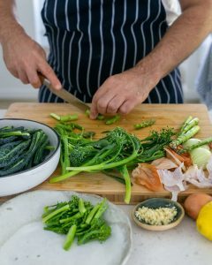 Cutting asparagus stem lengthwise for Casarecce Pasta with Asparagus, Kale and Garlic