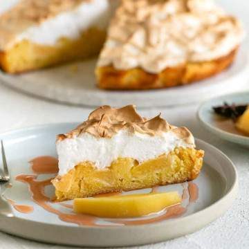 Slice of Quince Tart with Meringue on a plate