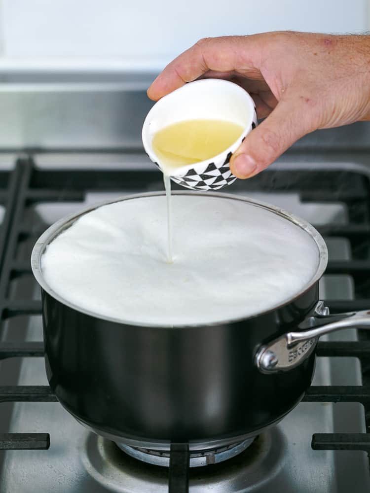 Add lemon juice slowly to the boiled milk