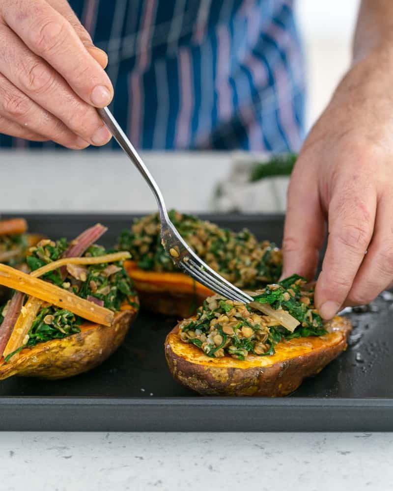 Assembling the sweet potato with lentils and swiss chard