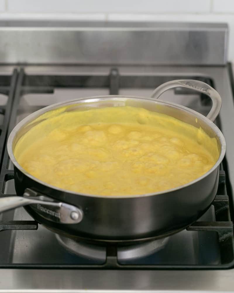 Curry sauce simmering in a pan