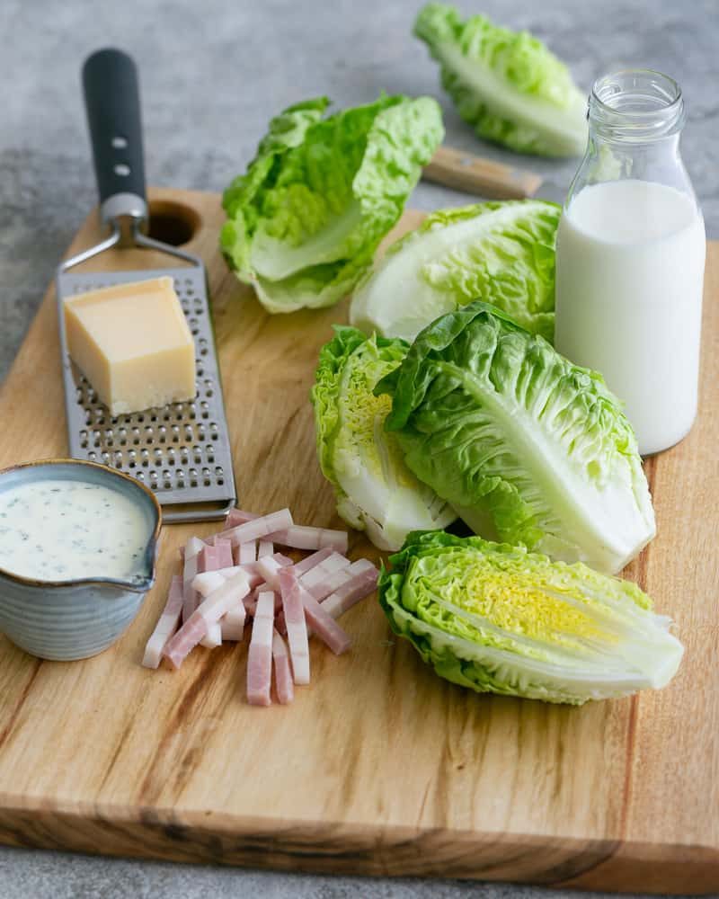 Ingredients on a wooden chopping board to make a salad