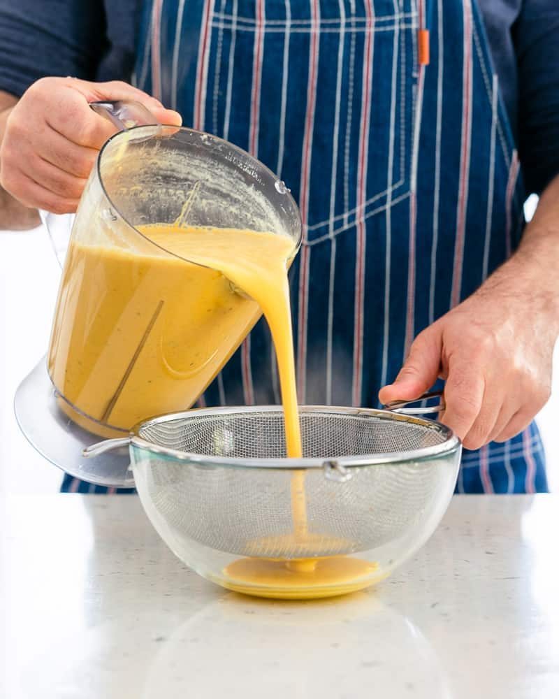 Blended Coconut curry sauce strained through a sieve