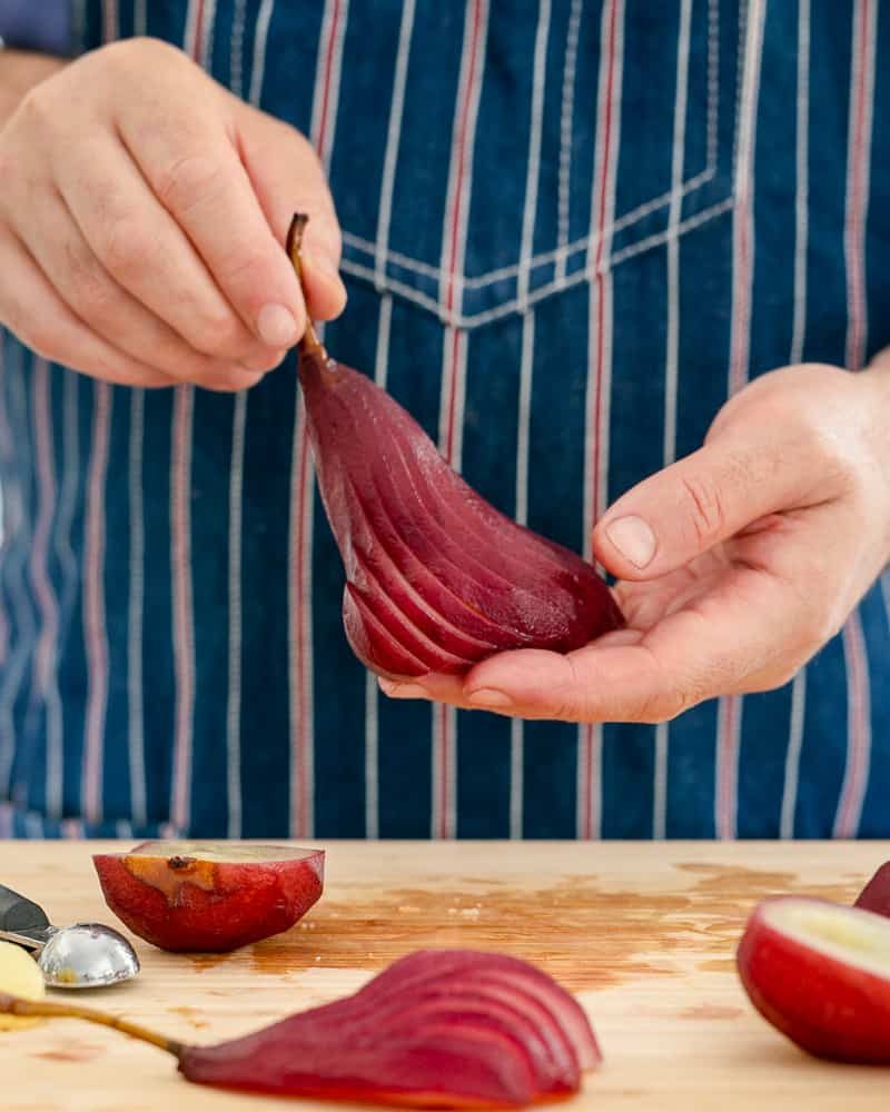 Pear cut in a fan shape to plate up spiced poached pears with mascarpone