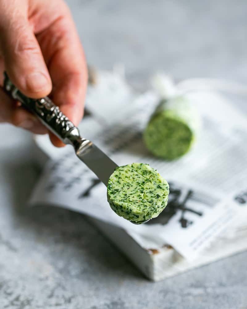 Sliced garlic herb butter after chilling for two hours in the fridge