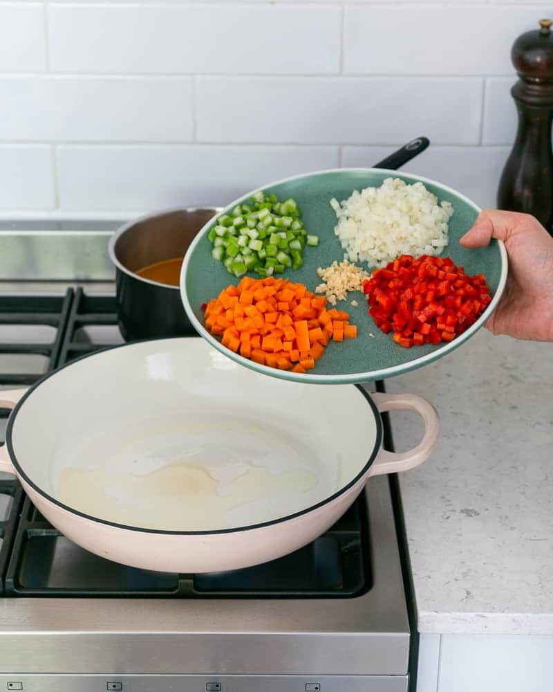 Adding chopped vegetable to make fregola