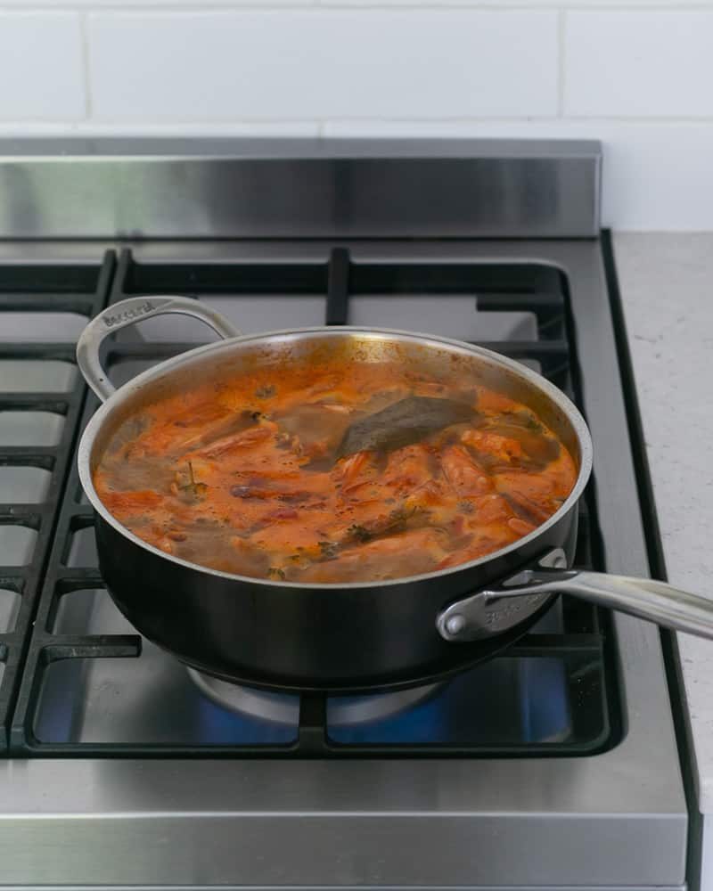 Add water to pan to make prawn stock