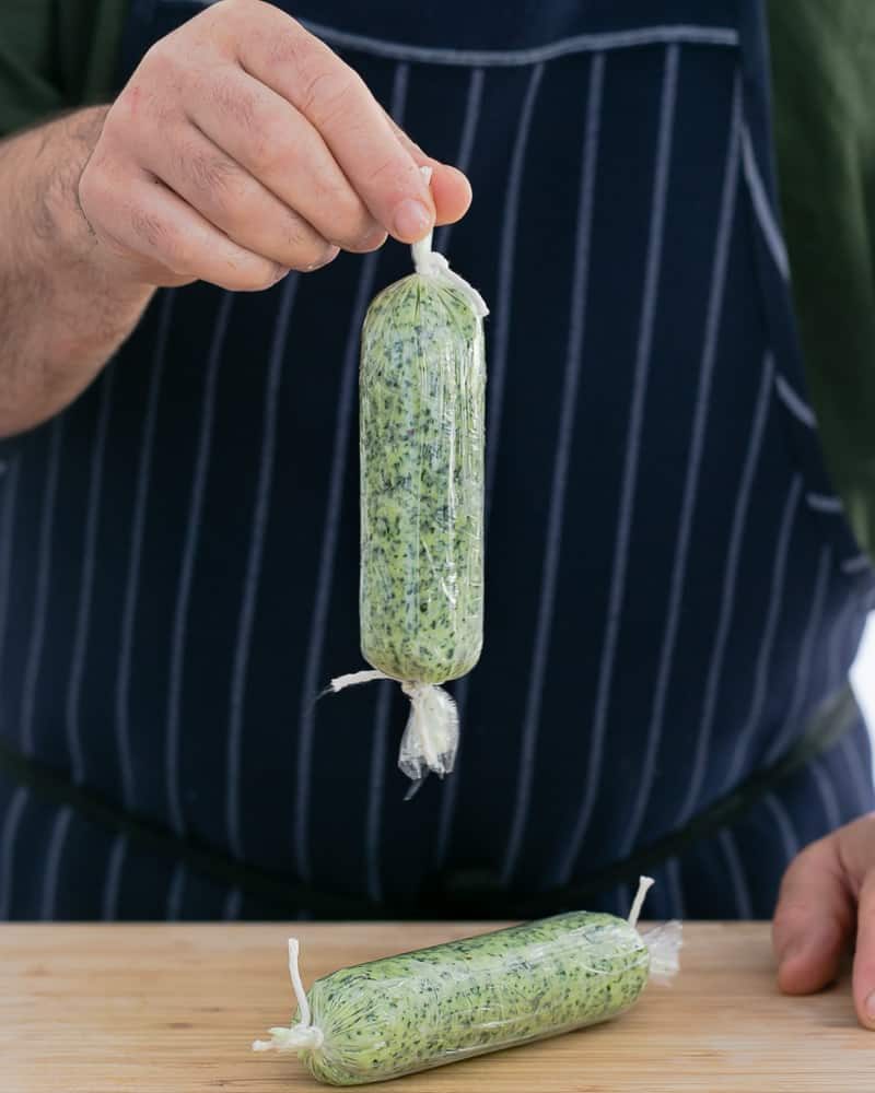 Tie ends of the garlic Herb butter log wrapped in a cling with a string