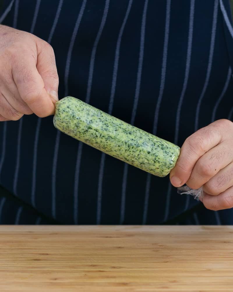 Garlic parsley Herb butter wrapped in cling to form a log