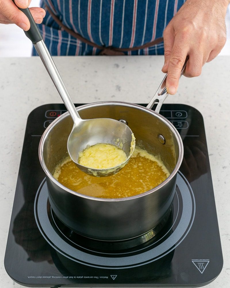 Clarifying butter with a spoon