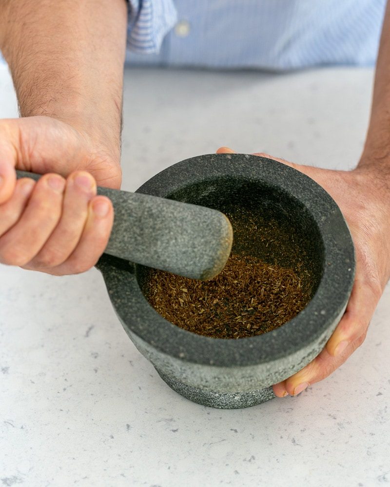 Toasted spices crusted in mortar and pestle