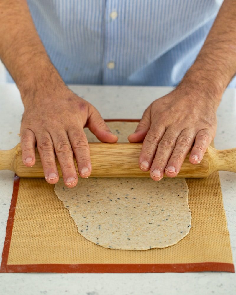 Rolling out the lavosh dough using a rolling pin