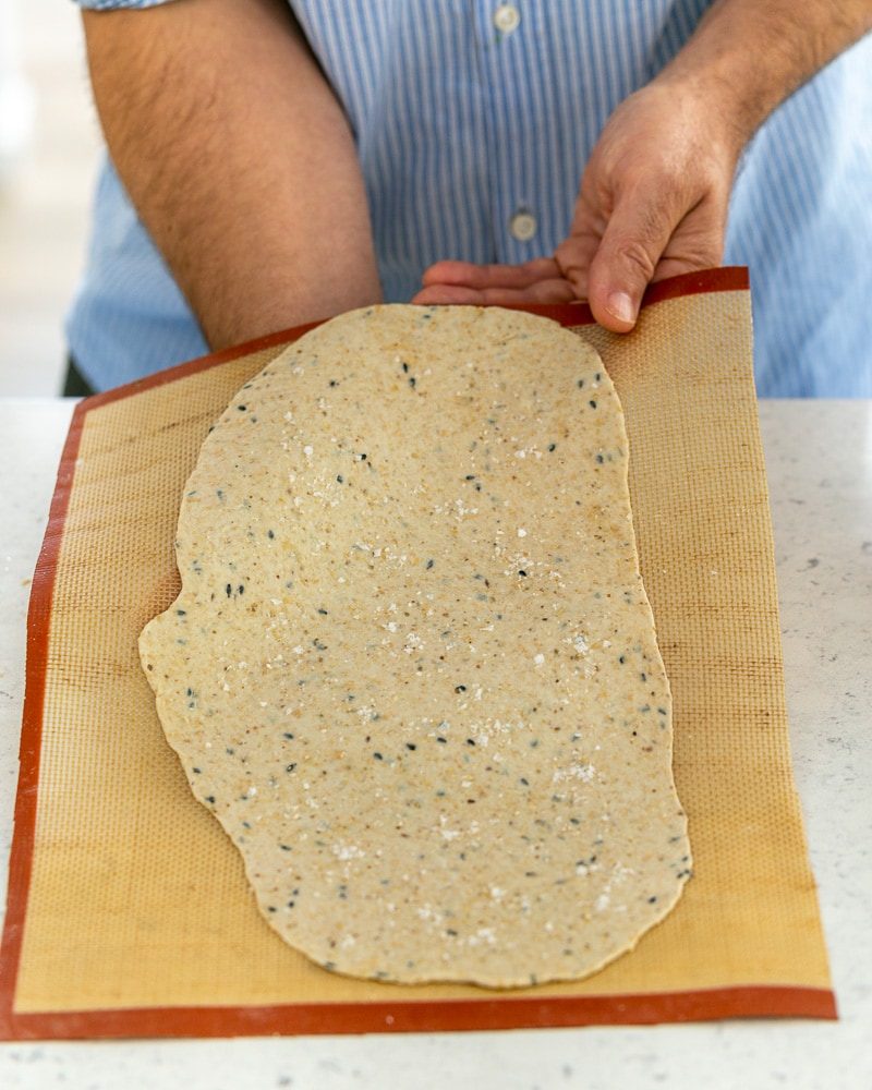 Rolled out lavosh dough on baking mat