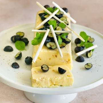 Close up Lemon Curd Semifreddo on a cake stand