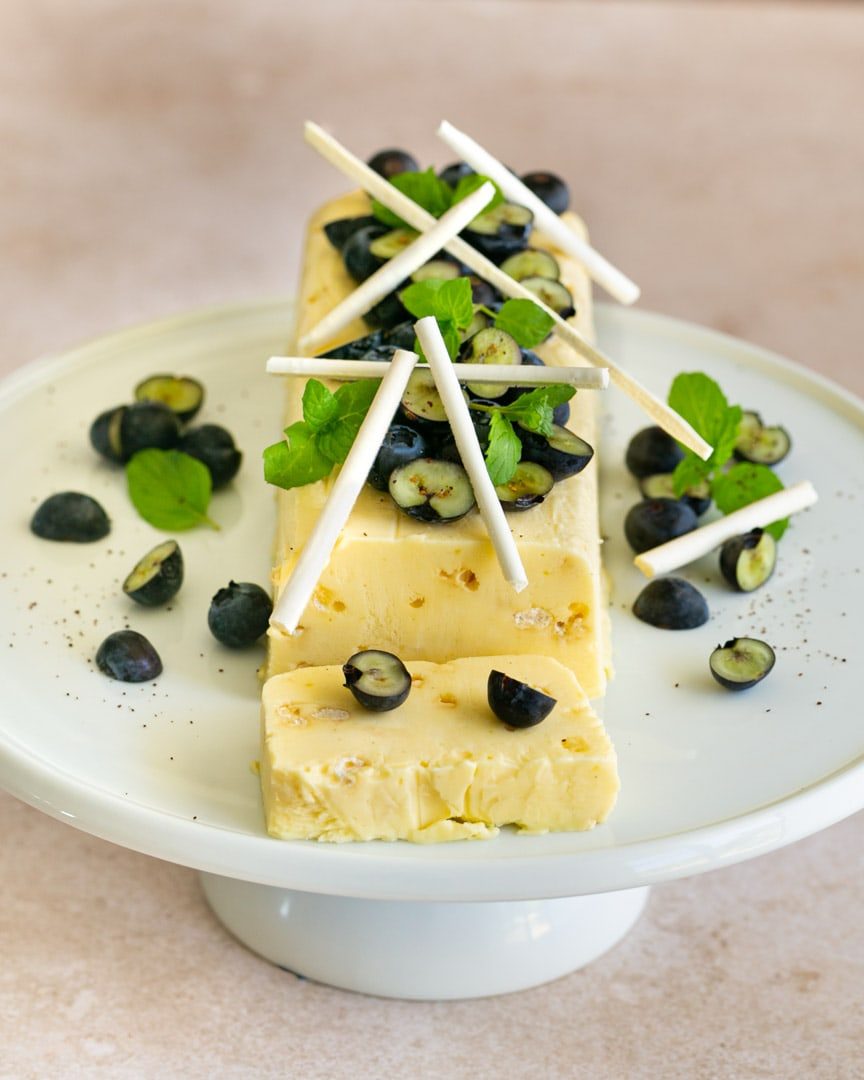 Close up Lemon Curd Semifreddo on a cake stand