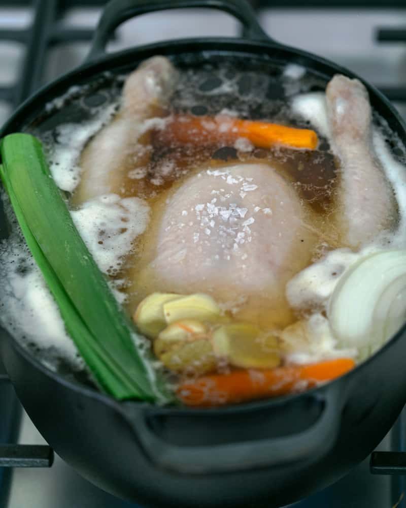Chicken broth simmering in a pot