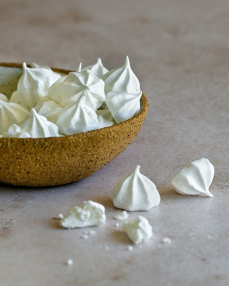 Meringue drops in a ceramic bowl