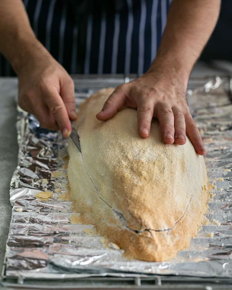 Opening-the-crust-of-the-Whole-baked-Barramundi-with-a-knife-32-of-1