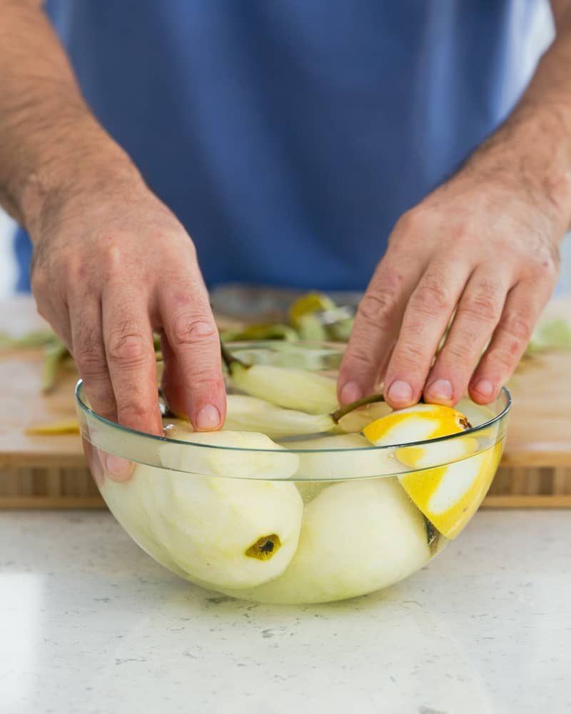 Peeled pears in lemon water to keep them from discolouring