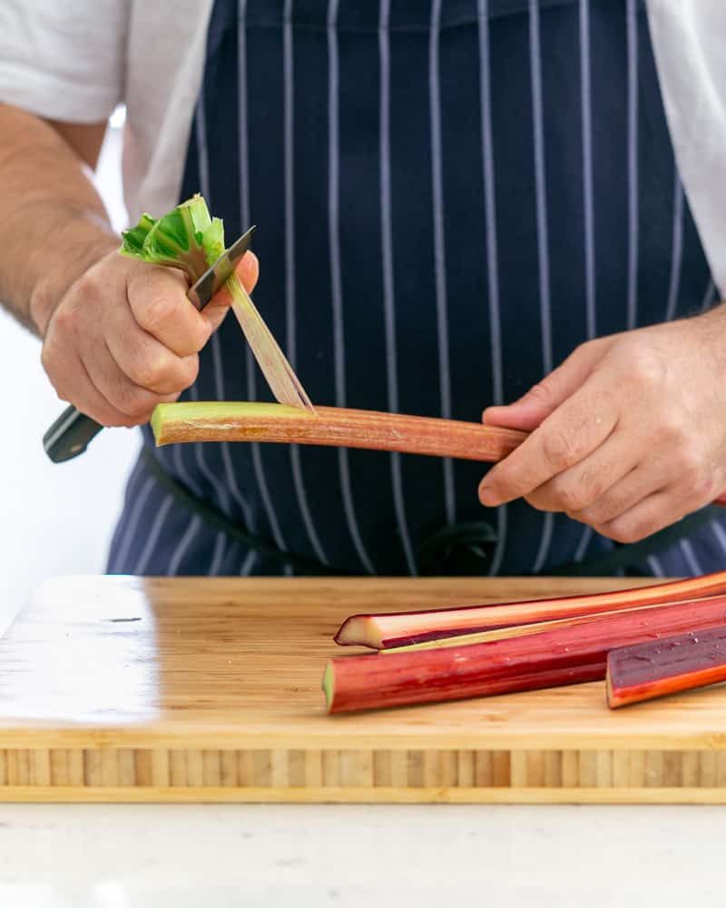 Peeling rhubarb with a small knife